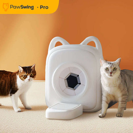Two cats beside the PawSwing AutoComb Pro, a white automatic grooming tool for cats.