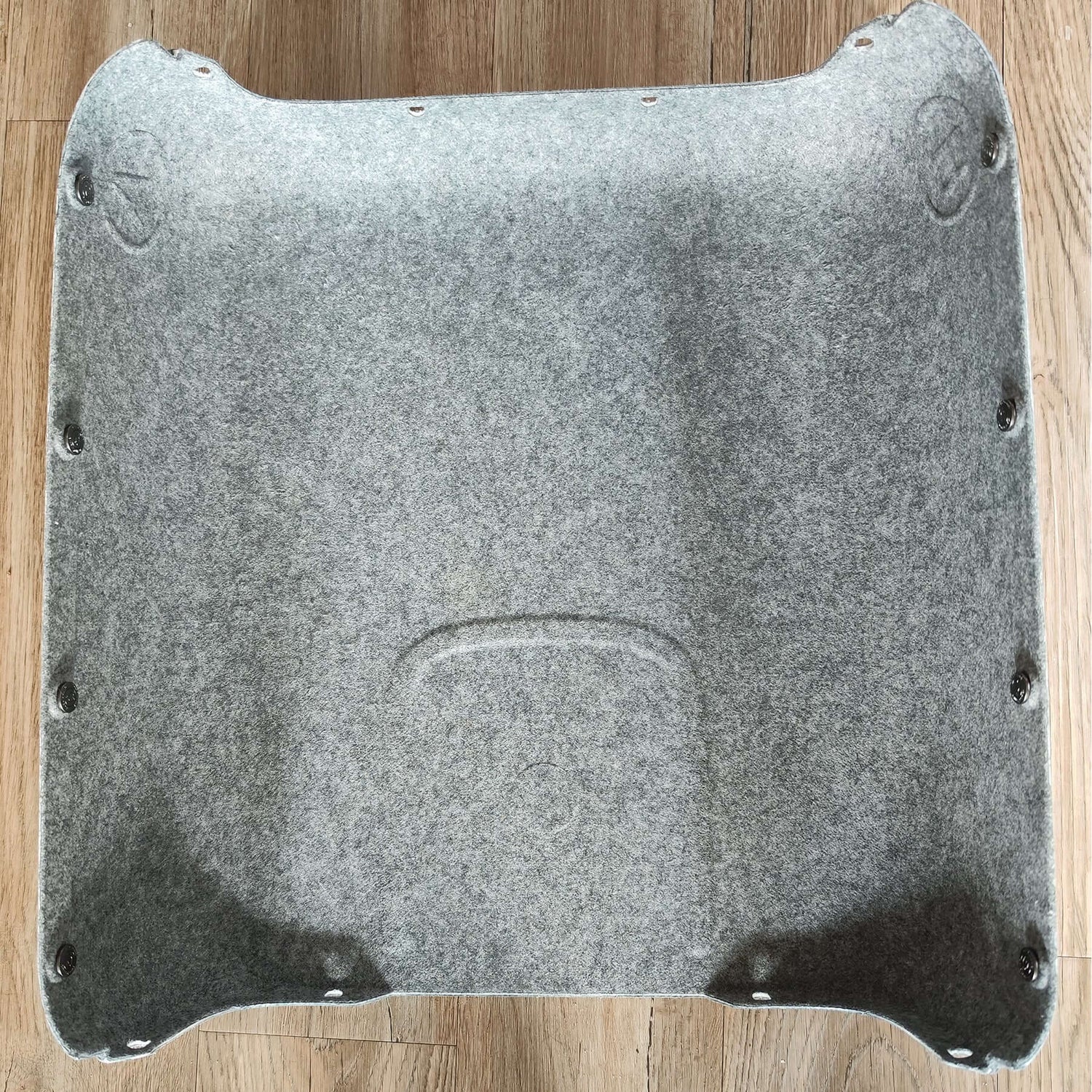 Top view of a gray felt grooming tool holder designed for efficient pet grooming.