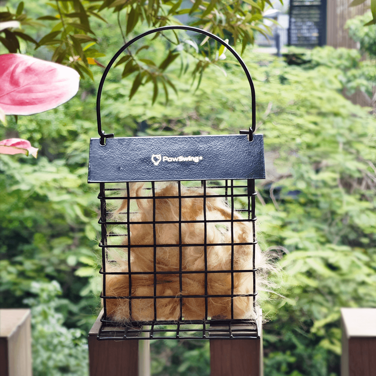 PawSwing Cat Hair Suet Collector filled with cat fur, providing nesting material for birds outdoors.