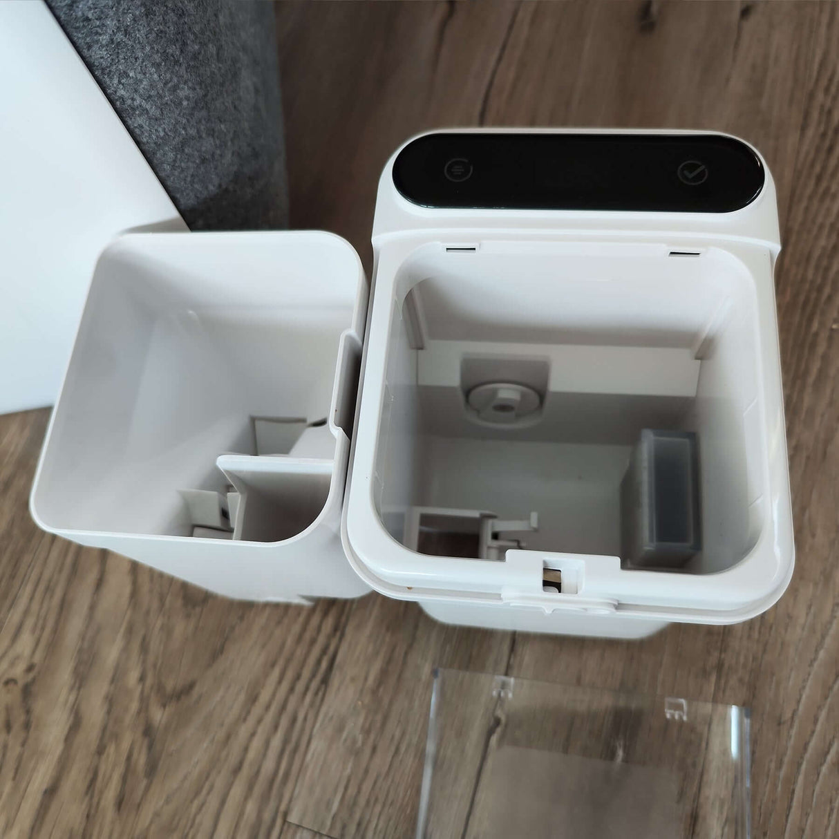 Interior view of a dual compartment grooming tool container, showcasing its design and functionality.
